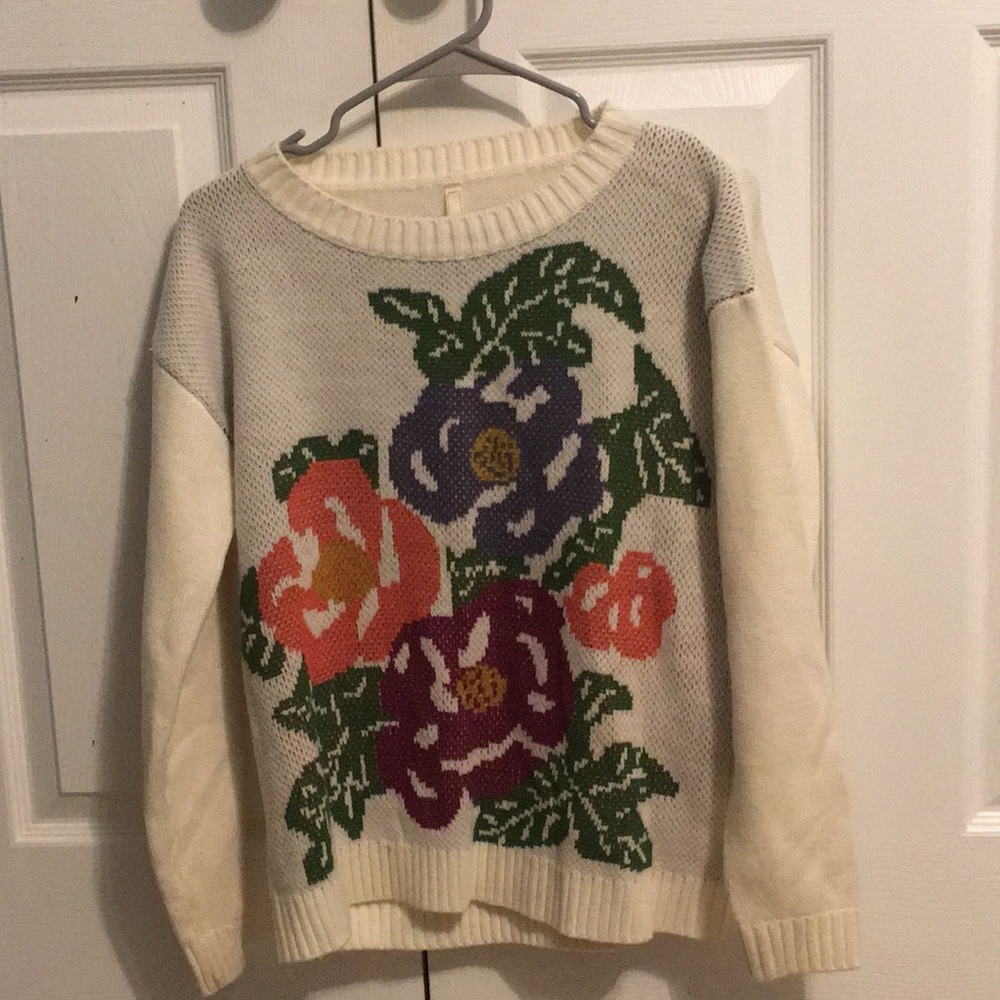 White sweater with floral design